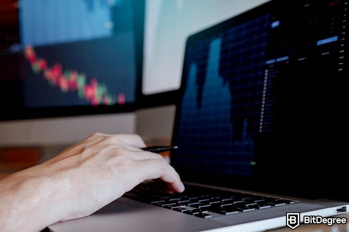 Hands typing on laptop keyboard